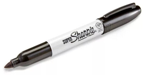 Black Sharpie fine point marker resting on a signed photo