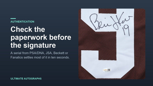 Close-up of a Bernie Kosar signature on a Browns jersey with a JSA Witnessed sticker below it