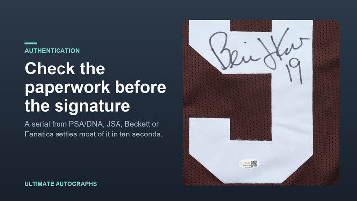 Close-up of a Bernie Kosar signature on a Browns jersey with a JSA Witnessed sticker below it