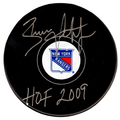 Brian Leetch Signed New York Rangers Hockey Puck (HOF 2009 Inscription)