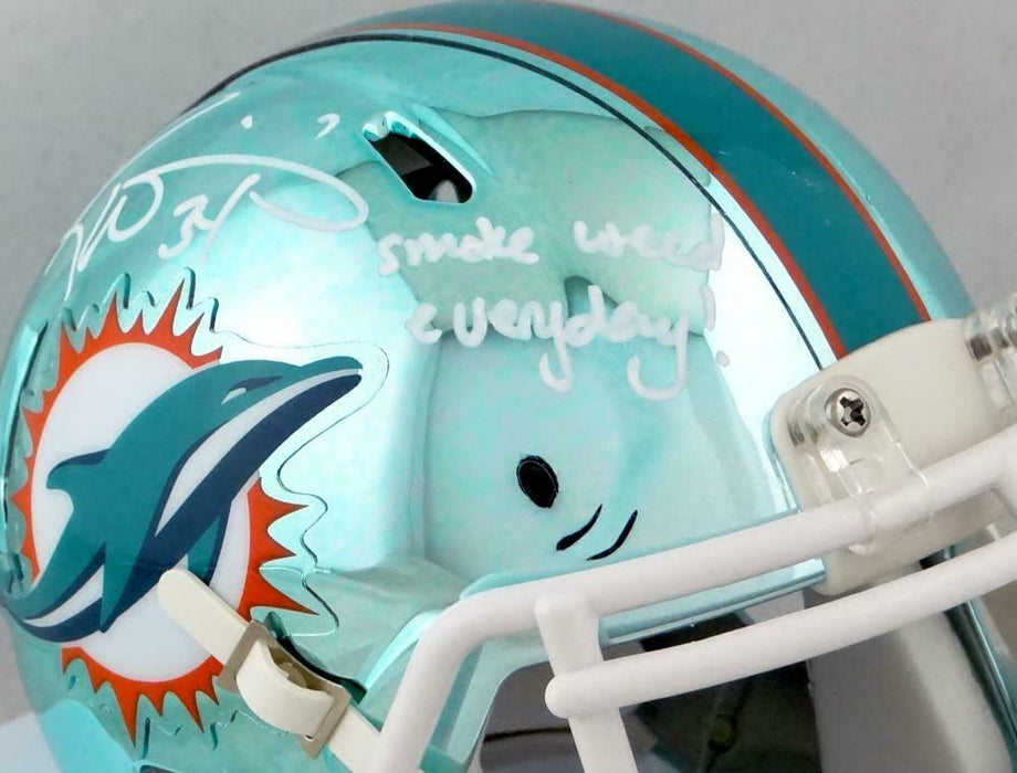 Usually just lurk around this sub, but thought I'd show you guys my  favorite piece of Dolphins memorabilia that I have. Signed Ricky Williams  mini helmet with the best inscription ever. :