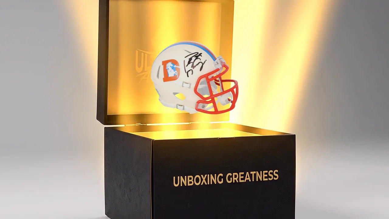 An autographed mini helmet rising out of the open box